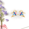 14K gold earrings with beautiful petals engraved with pink and blue stones