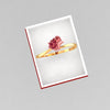 14K gold ring with a rose motif adorned with red stones