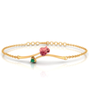 14K gold bracelet with a rose shaped design and a green stone 