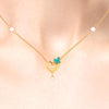 14K heart-shaped gold necklace with butterflies and a pearl drop 