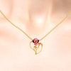 14K gold pendant with a rose on a leaf design  