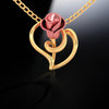 14K gold pendant with a rose on a leaf design  