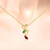 14K gold pendant with stone leaves and hollow leaves on a twig design 