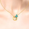 14K spherical gold pendant adorned with a butterfly on top and a hollowed-out butterfly in the center  