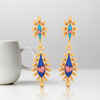 14K gold earrings with connected water droplet design and and beautiful detailing  