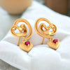 14k (585) Gold Earrings Swirling Design With Heart Shaped Dangles And Embedded Stones