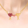 14K Gold Necklace With Hearts Held By Love Design