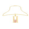 14K gold pendant in the shape of a girl in front of a window from Amazea Collection 