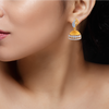 18K Jhumka Style Earring With A Leaf\
Shape Detail.