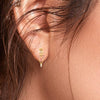 18K sturdy gold earrings with a hint of rose gold hue