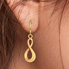 18K delicate gold earrings with an infinite design