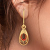 18K oval-shaped gold earrings with a distinctive design 