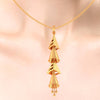 18K special pendant made of gold with four dangling cones