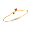 A 18K gold bracelet featuring a green stone and a rose-shaped design 