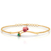 A 18K gold bracelet featuring a green stone and a rose-shaped design 