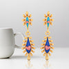 18K gold earrings with connected water droplet design and and beautiful detailing  