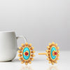 18K sunflower designed gold earrings with a heart in the center 