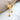 18K Gold Necklace With Heart Shaped Designs And Embedded Stones