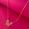 A dainty 22K gold chain with an elegantly shaped butterfly in the middle