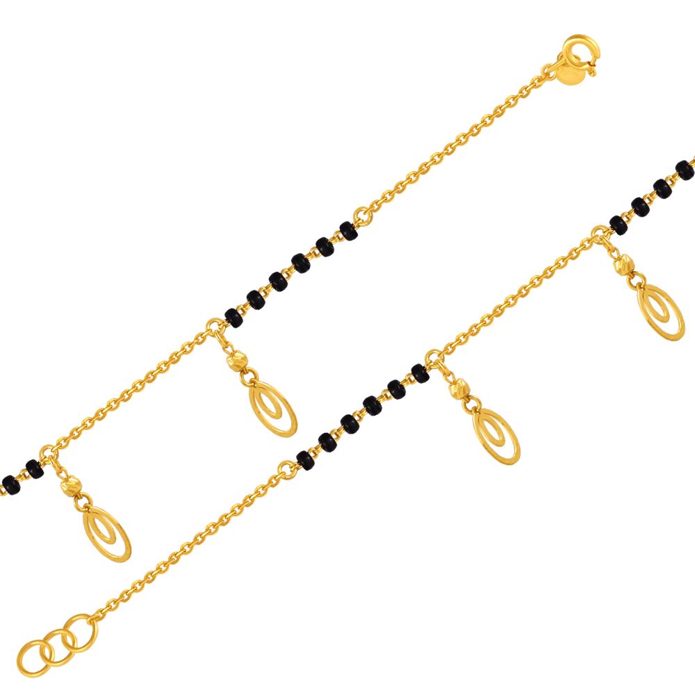 22K gold bracelet with concentric circle motifs and beads 